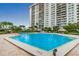 Refreshing swimming pool with surrounding patio at 400 Island Way # 1508, Clearwater Beach, FL 33767