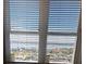 Stunning water view from large window with white blinds at 400 Island Way # 1508, Clearwater Beach, FL 33767