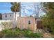 Small wooden storage shed in backyard at 404 87Th Ave, St Pete Beach, FL 33706