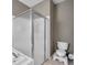 Bathroom with shower, toilet and a view of the bathtub at 4506 Mapletree Loop, Wesley Chapel, FL 33544