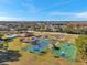 Aerial view showing community pool, playground, and courts at 4506 Mapletree Loop, Wesley Chapel, FL 33544