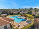 Community pool and lounging area at 4506 Mapletree Loop, Wesley Chapel, FL 33544