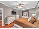 Main bedroom with king-size bed, dresser, and TV at 4506 Mapletree Loop, Wesley Chapel, FL 33544
