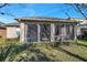 Relaxing screened porch with a view of the backyard at 4506 Mapletree Loop, Wesley Chapel, FL 33544