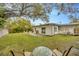 Relaxing backyard with patio, grill, firepit and lush landscaping at 4519 S Hesperides St, Tampa, FL 33611