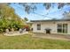 Large backyard with patio, grill, firepit and lush landscaping at 4519 S Hesperides St, Tampa, FL 33611