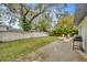 Spacious backyard with patio, grill, firepit, and lush landscaping at 4519 S Hesperides St, Tampa, FL 33611