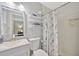 Updated bathroom with white vanity, marble shower, and modern fixtures at 4519 S Hesperides St, Tampa, FL 33611