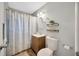 Clean bathroom with shower/tub combo, wood vanity, and updated fixtures at 4519 S Hesperides St, Tampa, FL 33611