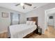 Bright bedroom with double bed, nightstand, and access to hallway at 4519 S Hesperides St, Tampa, FL 33611
