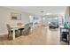 Dining area with white table, gray chairs, and hardwood floors at 4519 S Hesperides St, Tampa, FL 33611