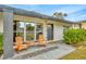 Inviting front porch with wooden rocking chairs and a stone pathway at 4519 S Hesperides St, Tampa, FL 33611