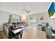 Spacious living room featuring gray sectional sofa and sliding glass doors at 4519 S Hesperides St, Tampa, FL 33611