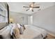 Large bedroom with king bed, ceiling fan, and access to bathroom at 4519 S Hesperides St, Tampa, FL 33611