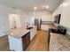 Modern kitchen with granite countertops and island at 5237 Aberback St, North Port, FL 34291