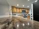 Kitchen boasts a large island with granite countertop and modern fixtures at 5400 Park N St # 209, St Petersburg, FL 33709