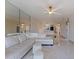 Bright living room features a large sectional sofa and mirrored wall at 5400 Park N St # 209, St Petersburg, FL 33709