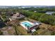 Community pool with lounge chairs and a nearby clubhouse at 5400 Park N St # 209, St Petersburg, FL 33709