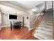 Carpeted stairs and hardwood floors in the entryway at 5604 Miley Rd, Plant City, FL 33565