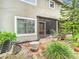 Private backyard with patio, screen enclosure, and mature landscaping at 5832 Red Cedar Ln, Tampa, FL 33625