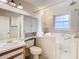 Bathroom with walk-in tub, toilet, and vanity at 5832 Red Cedar Ln, Tampa, FL 33625