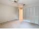 Bright bedroom with ample closet space and neutral carpeting at 5832 Red Cedar Ln, Tampa, FL 33625