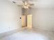 Large bedroom with ceiling fan and carpet at 5832 Red Cedar Ln, Tampa, FL 33625