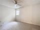 Bedroom with ceiling fan and window at 5832 Red Cedar Ln, Tampa, FL 33625