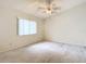 Bright bedroom with ceiling fan and carpeted floor at 5832 Red Cedar Ln, Tampa, FL 33625