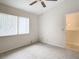 Bedroom with window, ceiling fan, and carpet at 5832 Red Cedar Ln, Tampa, FL 33625