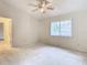 Bedroom with ceiling fan, window, and carpet at 5832 Red Cedar Ln, Tampa, FL 33625