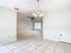 Dining room with tile floors and view into living room at 5832 Red Cedar Ln, Tampa, FL 33625