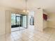 Dining room with view into kitchen and access to screened patio at 5832 Red Cedar Ln, Tampa, FL 33625