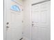 Interior entryway with two white doors at 5832 Red Cedar Ln, Tampa, FL 33625
