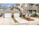 Two-car garage and well-maintained landscaping at 5832 Red Cedar Ln, Tampa, FL 33625