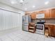 Modern kitchen with stainless steel appliances and wood cabinets at 5832 Red Cedar Ln, Tampa, FL 33625