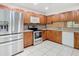 Modern kitchen with stainless steel appliances and wood cabinets at 5832 Red Cedar Ln, Tampa, FL 33625