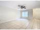 Living room with tile floor, ceiling fan, and window with blinds at 5832 Red Cedar Ln, Tampa, FL 33625