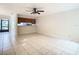 Spacious living room with tile floors and a ceiling fan at 5832 Red Cedar Ln, Tampa, FL 33625