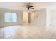 Bright living room with tile floors, ceiling fan, and lots of natural light at 5832 Red Cedar Ln, Tampa, FL 33625