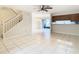 Open living room and dining area with tile floor and ceiling fan at 5832 Red Cedar Ln, Tampa, FL 33625