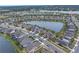 Community neighborhood with lake and various houses at 6216 Kevesta Ave, Palmetto, FL 34221