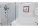 Bathroom with glass shower and soaking tub at 6216 Kevesta Ave, Palmetto, FL 34221