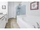 Clean bathroom with soaking tub and glass shower at 6216 Kevesta Ave, Palmetto, FL 34221