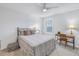 Cozy bedroom with a comfortable bed and a workspace at 6216 Kevesta Ave, Palmetto, FL 34221