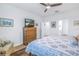 Spacious bedroom with a large TV and en-suite bathroom at 6216 Kevesta Ave, Palmetto, FL 34221