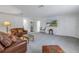 Spacious bonus room with leather sofas and a TV at 6216 Kevesta Ave, Palmetto, FL 34221