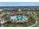 Aerial view of community center with pool and surrounding homes at 6216 Kevesta Ave, Palmetto, FL 34221