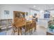 Charming dining area with a wood table and hutch, near kitchen at 6216 Kevesta Ave, Palmetto, FL 34221