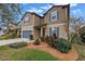 Two-story house with a landscaped front yard and attached garage at 6216 Kevesta Ave, Palmetto, FL 34221